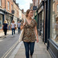 ⏳Time-Limited Special⏰Women’s Leopard Twist-Front Top – V-Neck, Peplum Hem, Bold Print 💃